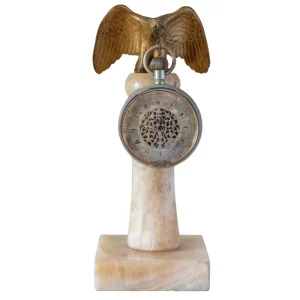 Reloj turco soportado por águila de bronce sobre peana de mármol blanco Particular