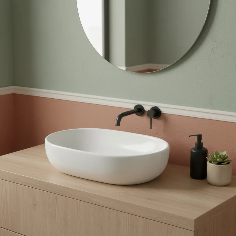 Lavabo de apoyo ovalado en cerámica blanca 58x41 con borde fino
